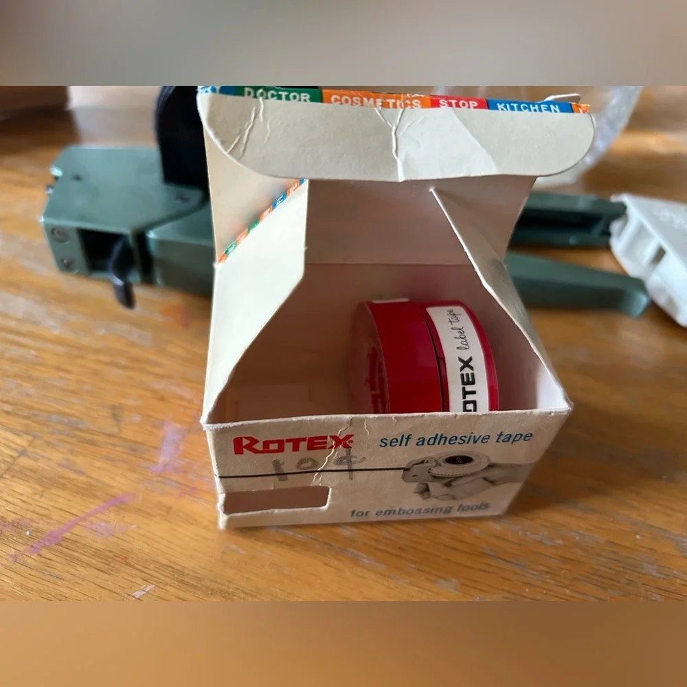Apsco label maker with two rolls of red tape